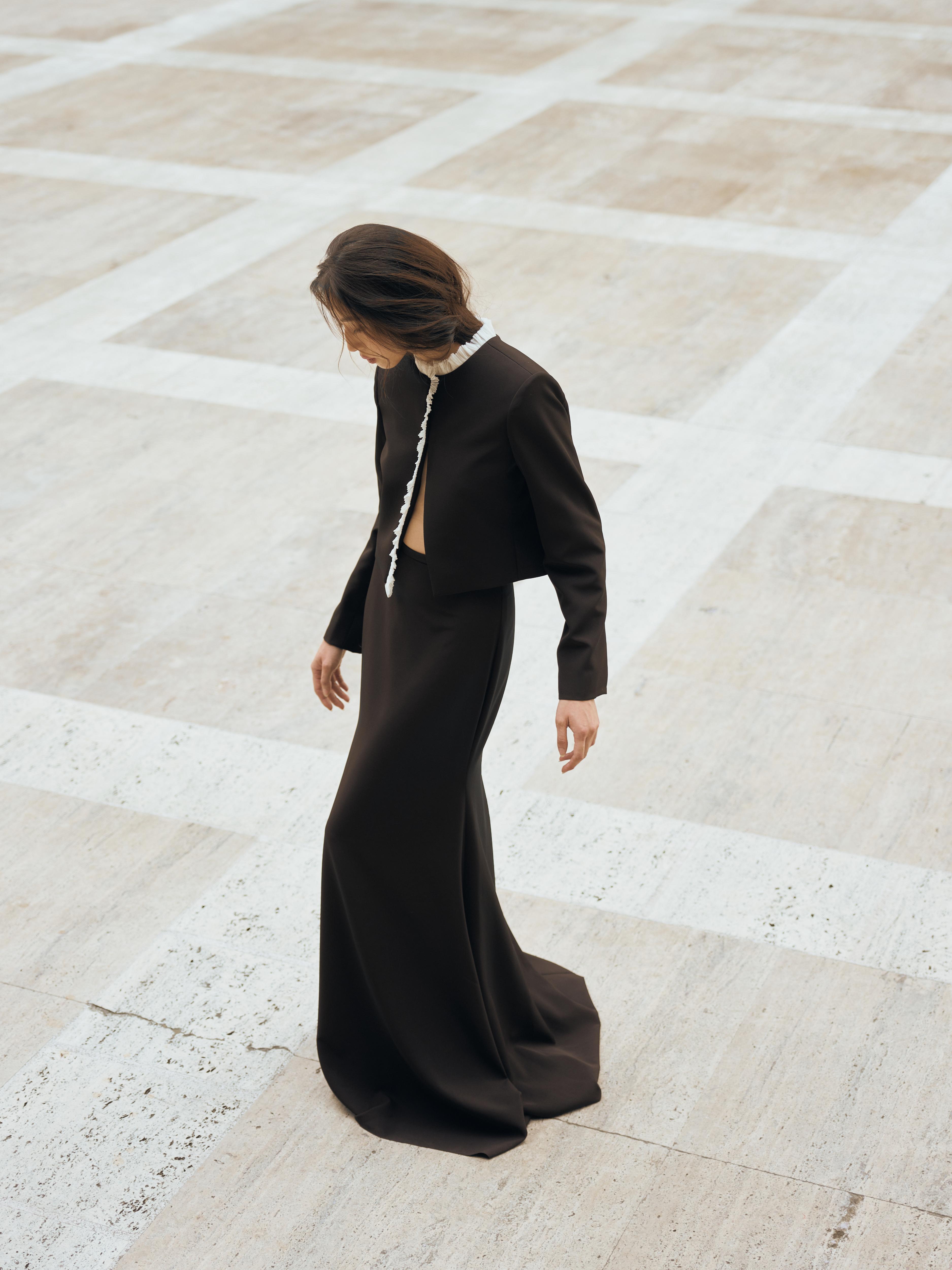 Vania Romoff The Ada Jacket in black and white features a structured silhouette in black neocrepe. Contrasting white trim frames the neckline 