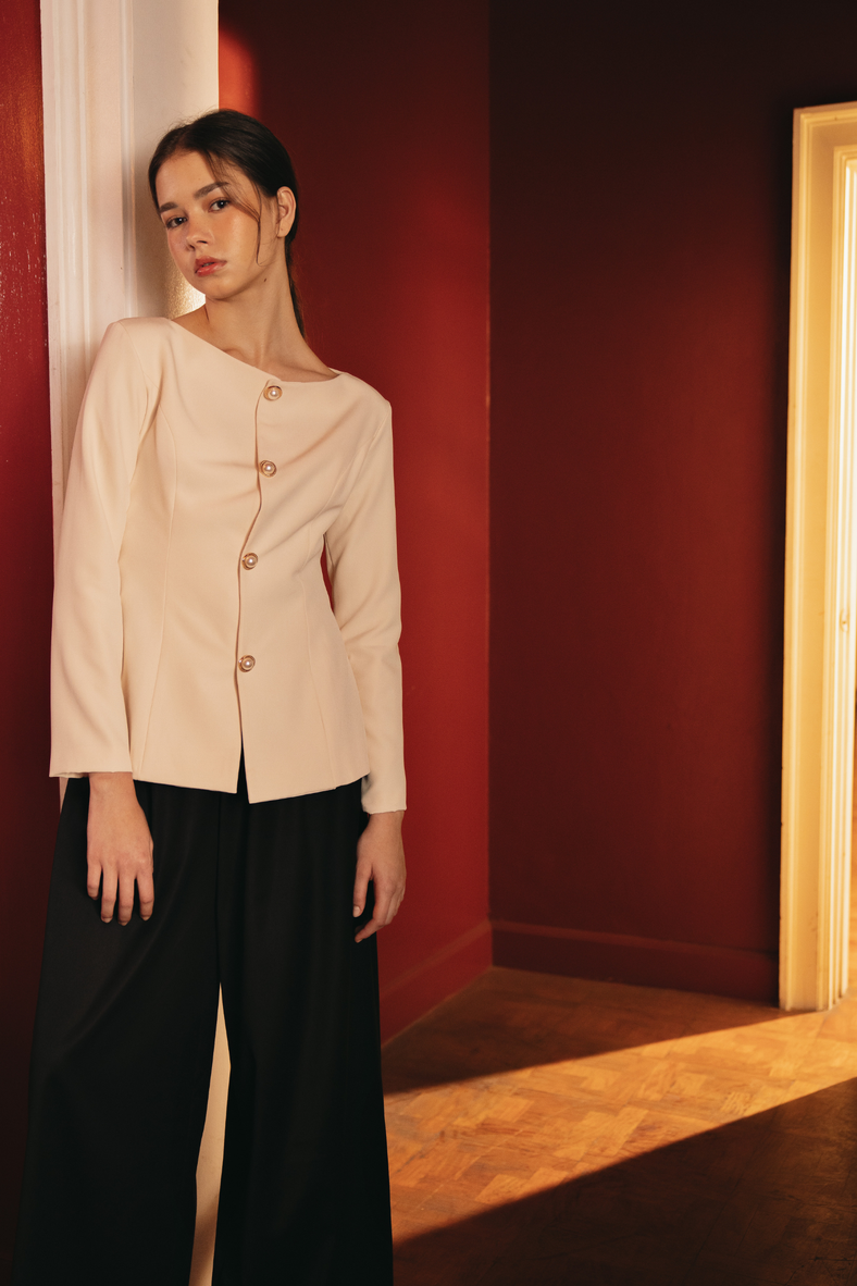Vania Romoff The Constance Top in cream is a tailored blouse and is finished with a gold-plated and pearl closures