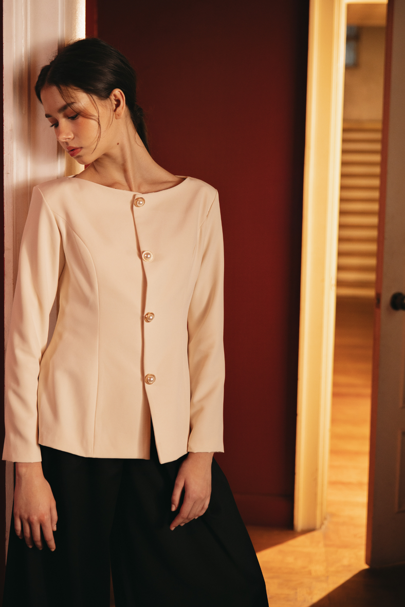 Vania Romoff The Constance Top in cream is a tailored blouse and is finished with a gold-plated and pearl closures