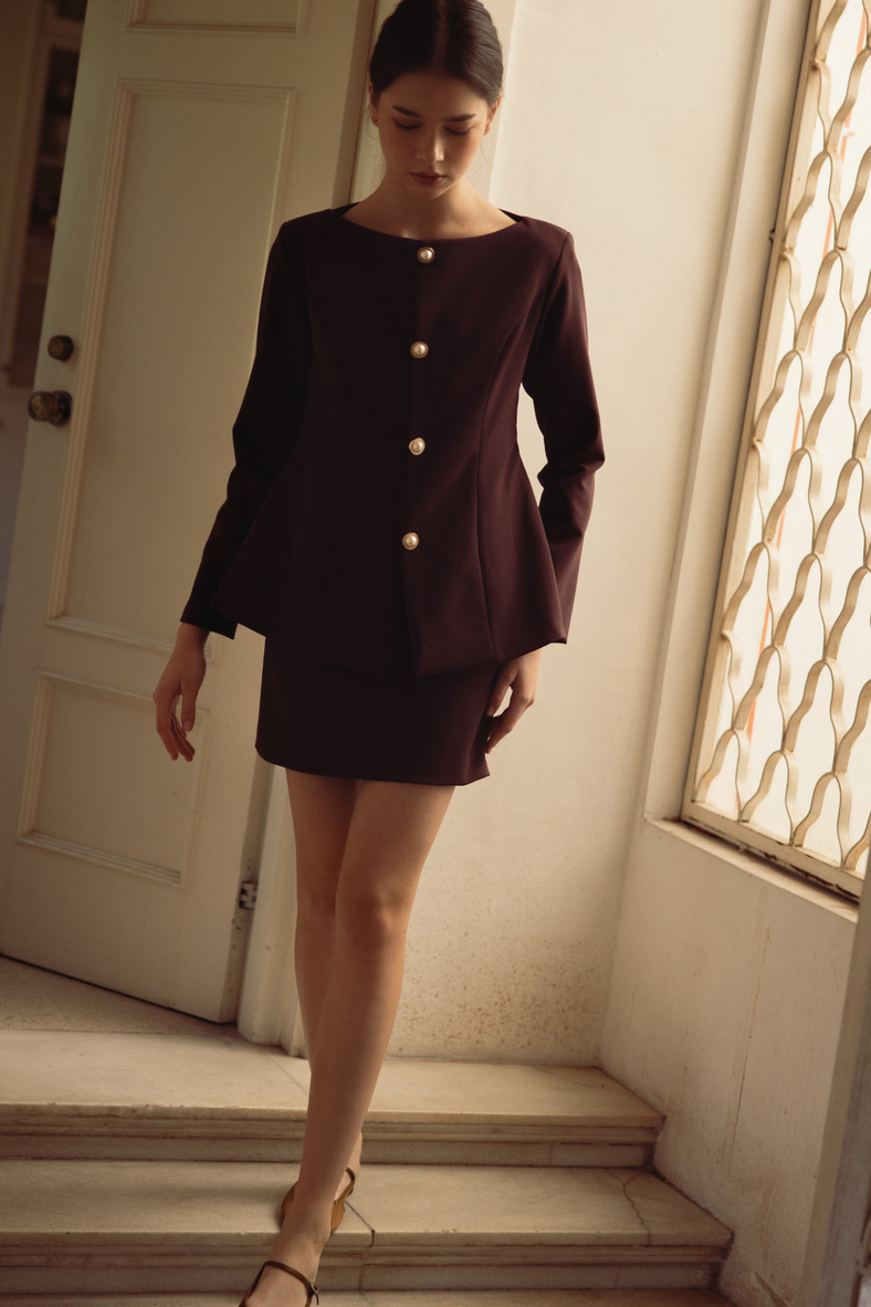 Vania Romoff The Constance Top in mulberry is a tailored blouse and is finished with a gold-plated and pearl closures