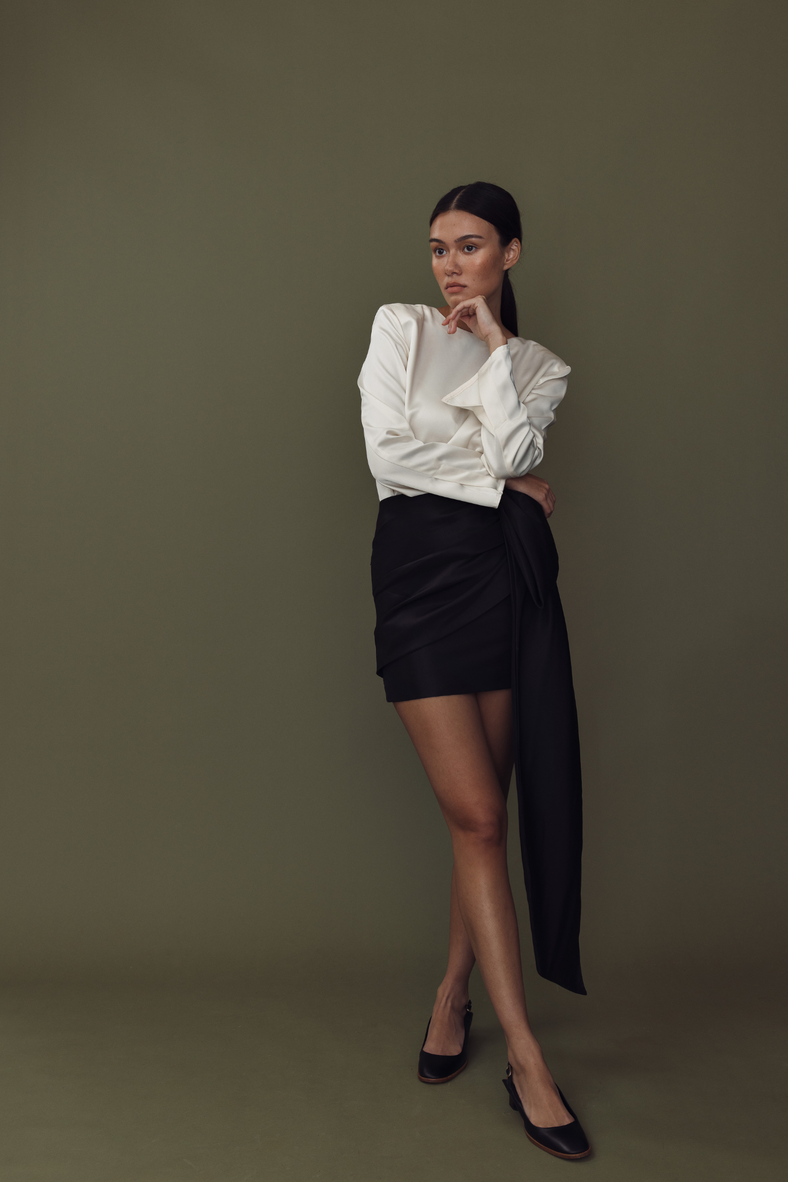Vania Romoff The Demi Skirt in black  features a draped bow and is made from crisp nylon taffeta