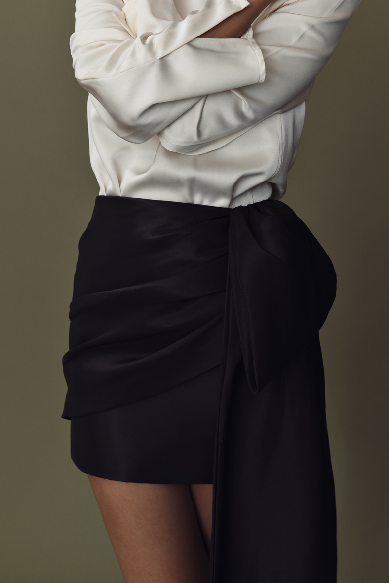 Vania Romoff The Demi Skirt in black  features a draped bow and is made from crisp nylon taffeta