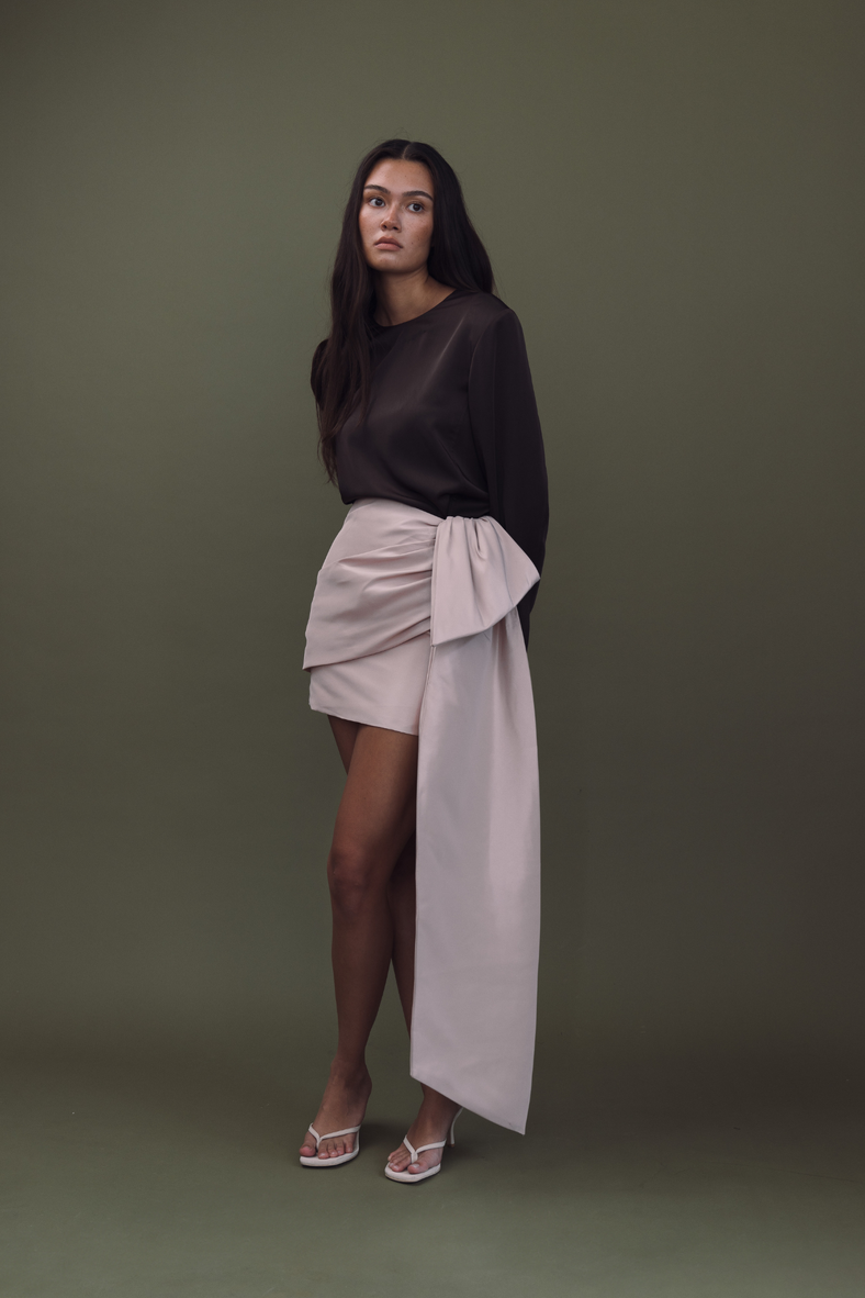 Vania Romoff The Demi Skirt in blush features a draped bow and is made from crisp nylon taffeta