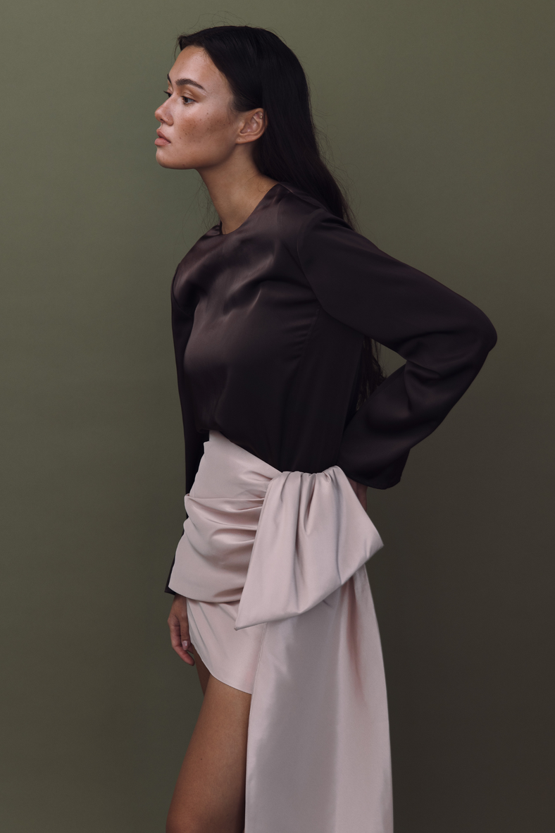 Vania Romoff The Demi Skirt in blush features a draped bow and is made from crisp nylon taffeta
