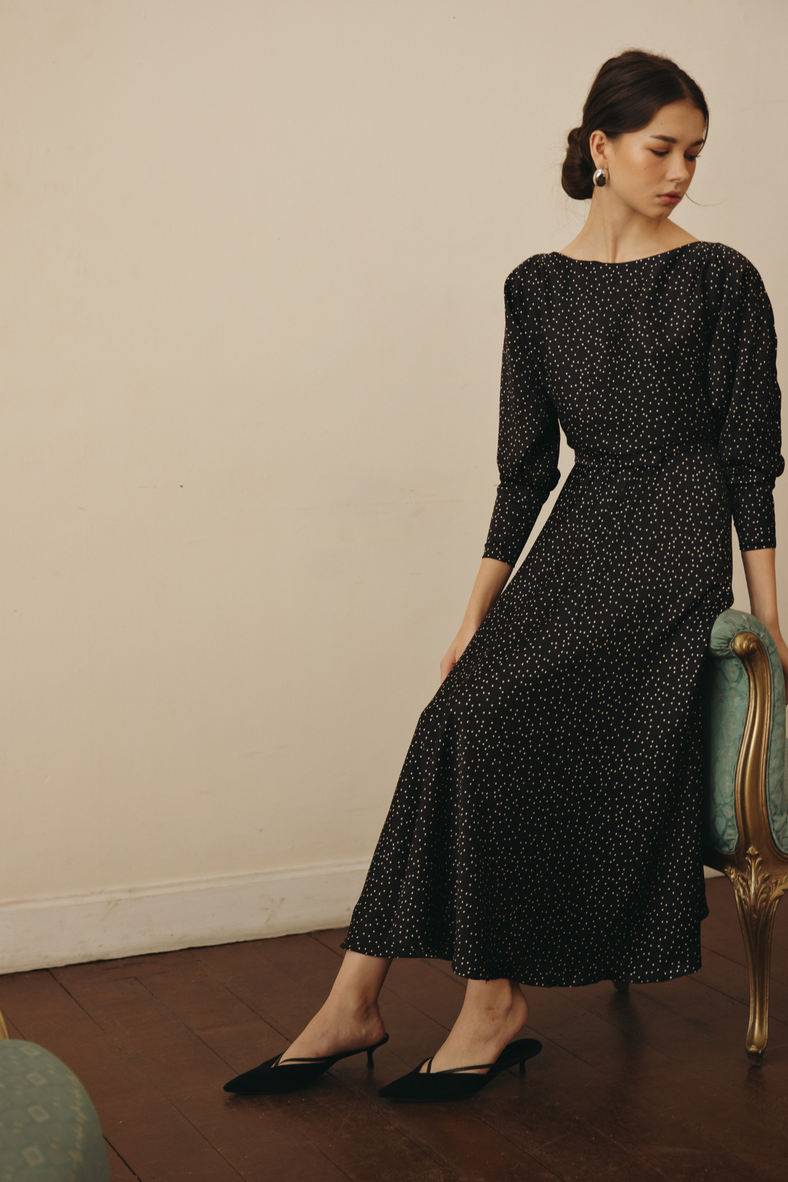 Vania Romoff Helen Dress in black polka dot polka-dot print, features a Sabrina neckline, padded dolman sleeves and and is cinched at the waist 