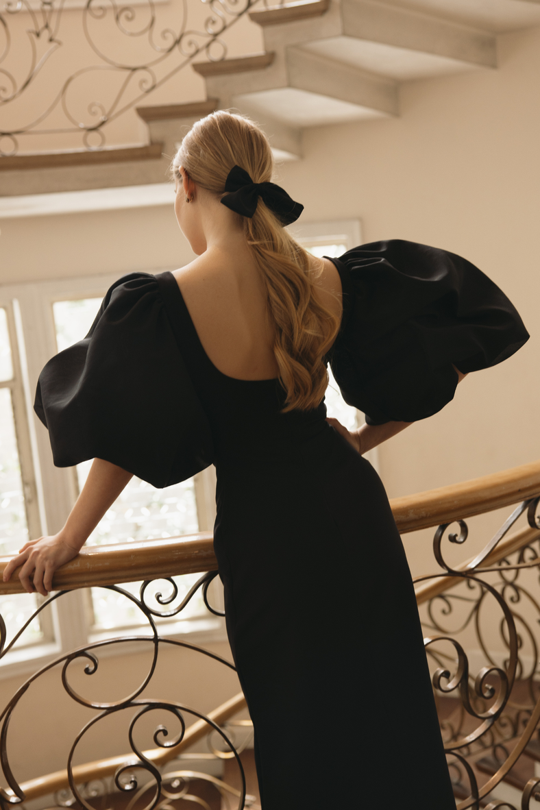  Vania Romoff Sigrid dress in black is a flattering midi dress is framed with voluminous puff sleeves 