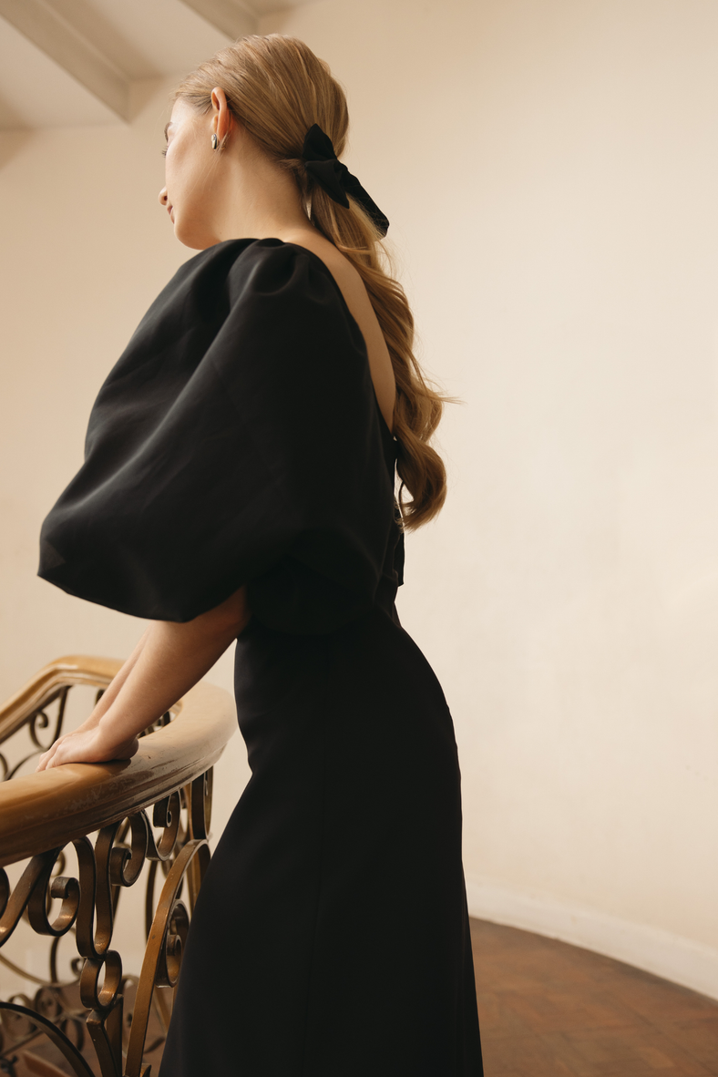  Vania Romoff Sigrid dress in black is a flattering midi dress is framed with voluminous puff sleeves 