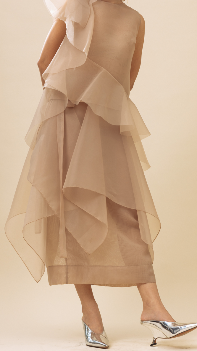 Sally wears The Peplum Wrap in nude