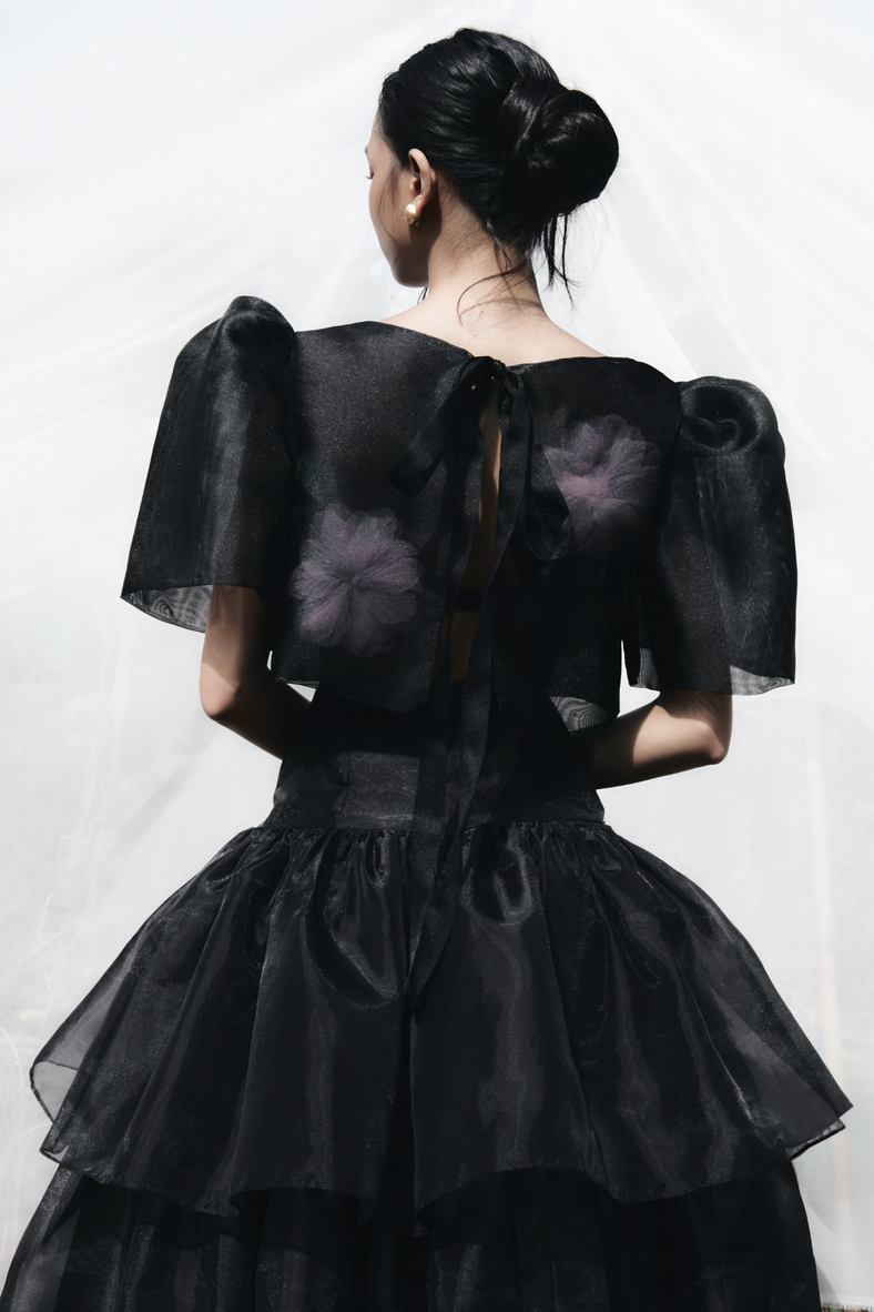 Vania Romoff The Camisa Top with floral appliqué in black is made with light and airy french gauze fabric and has delicate floral appliqué