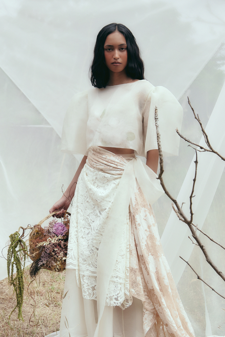 Vania Romoff The Camisa Top with floral appliqué in ivory is made with light and airy french gauze fabric and has delicate floral appliqué