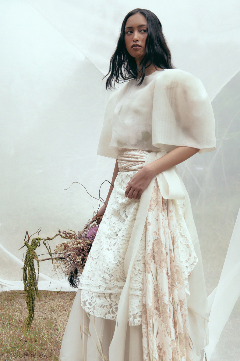 Vania Romoff The Camisa Top with floral appliqué in ivory is made with light and airy french gauze fabric and has delicate floral appliqué