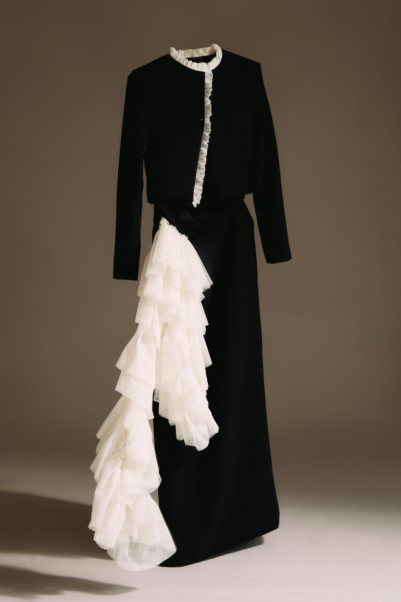 Vania Romoff The Ada Jacket in black and white features a structured silhouette in black neocrepe. Contrasting white trim frames the neckline 
