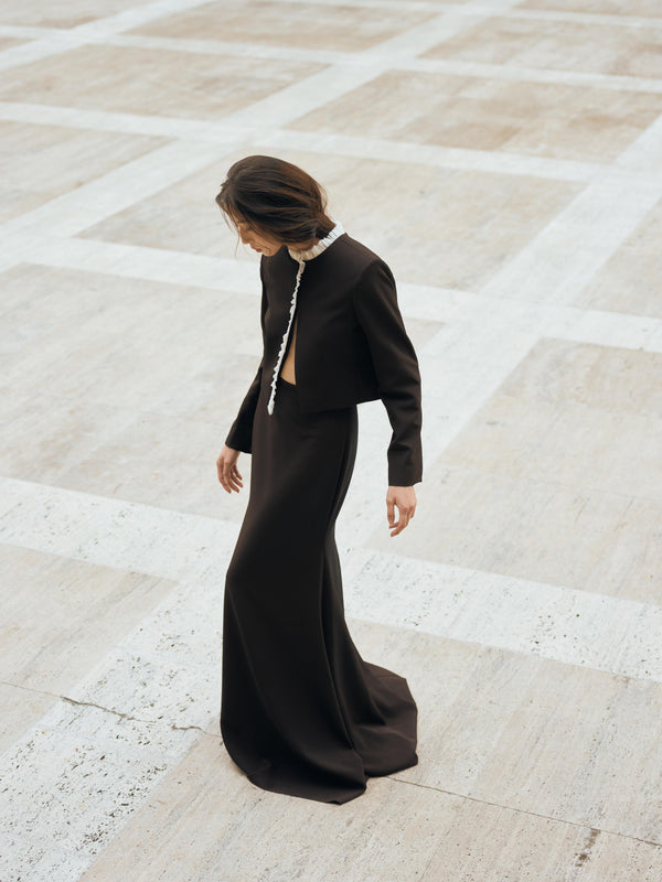 Vania Romoff The Ada Jacket in black and white features a structured silhouette in black neocrepe. Contrasting white trim frames the neckline 