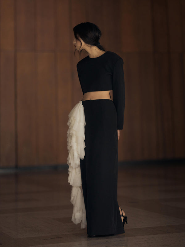 Vania Romoff The Alma Skirt features a sleek, floor-length silhouette in black neocrepe