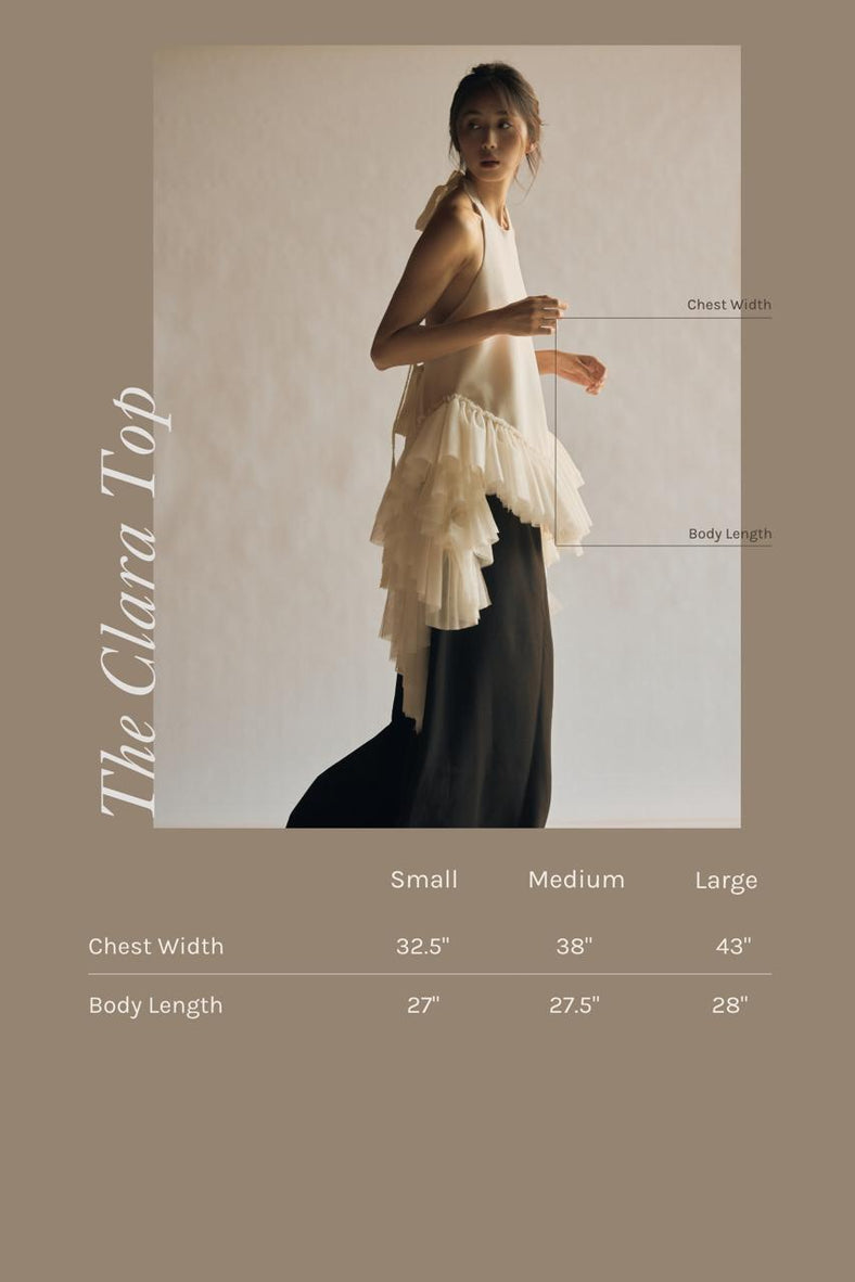  Vania Romoff The Clara Top in ivory features a halter neckline and a relaxed, flowing silhouette in ivory stretch crepe measurements