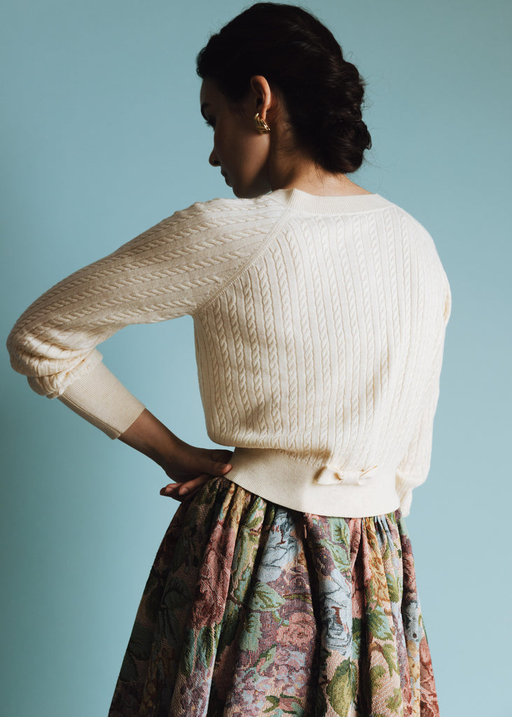 Vania Romoff Lucy Cardigan in Cream crafted from soft wool with ribbon detail at the back