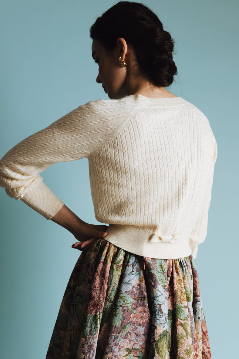 Vania Romoff Lucy Cardigan in Cream crafted from soft wool with ribbon detail at the back