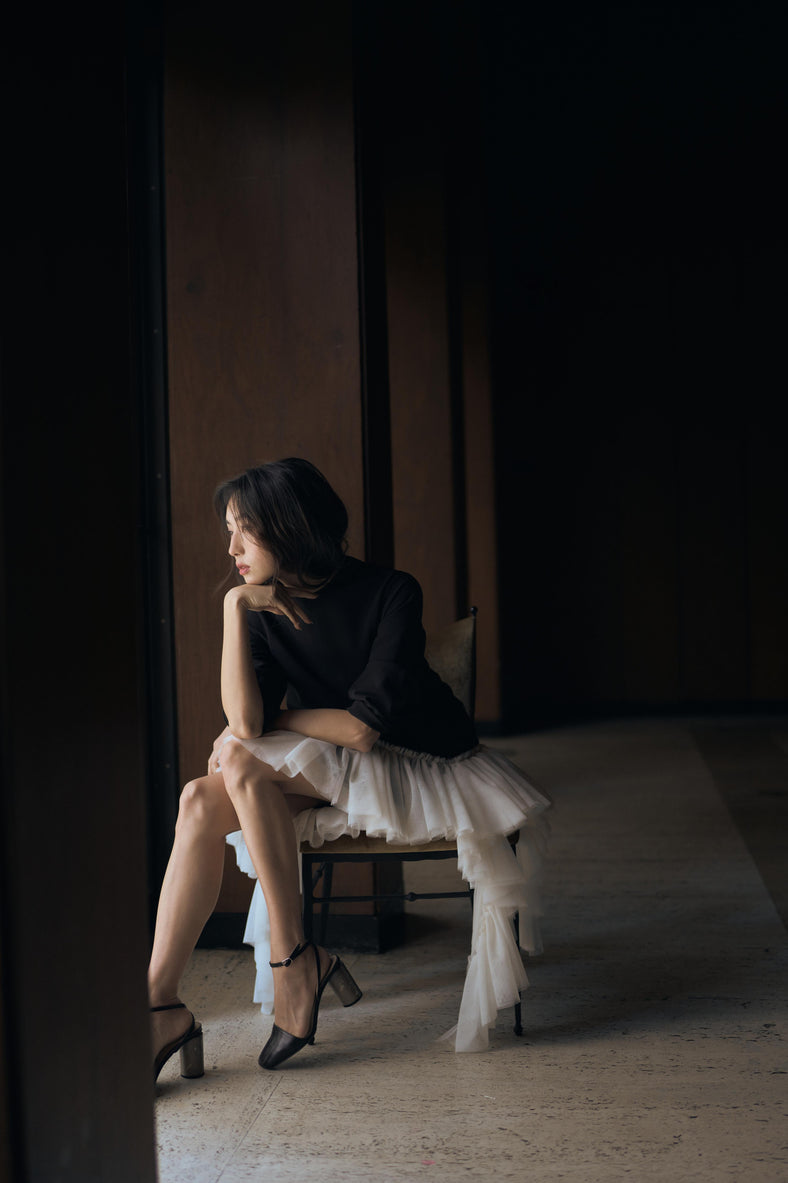 Vania Romoff The Ophelia Dress in black and white features a relaxed silhouette in ivory stretch crepe, with softly gathered sleeves and cascading ruffles 
