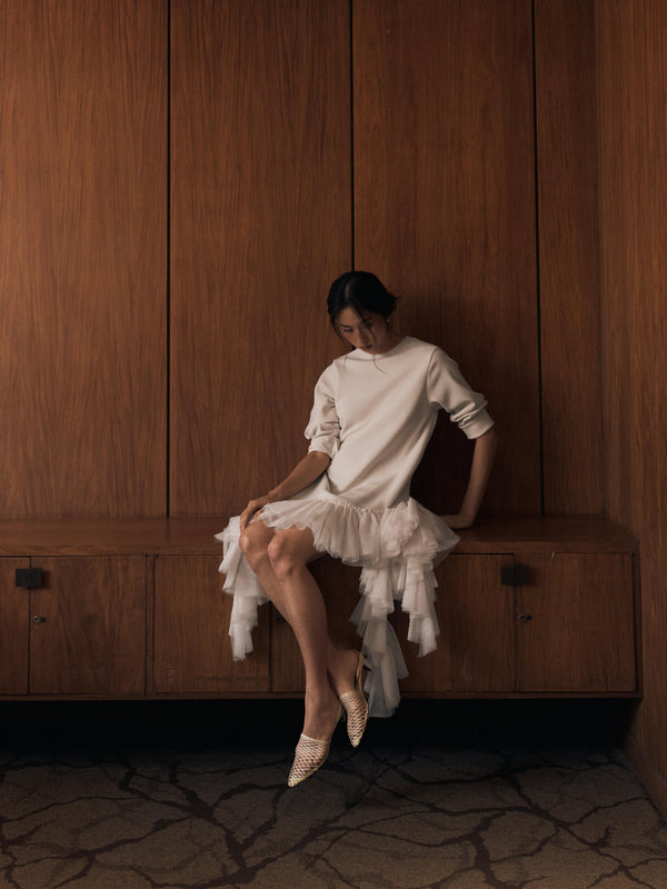 Vania Romoff The Ophelia Dress in ivory  features a relaxed silhouette in ivory stretch crepe, with softly gathered sleeves and cascading ruffles 