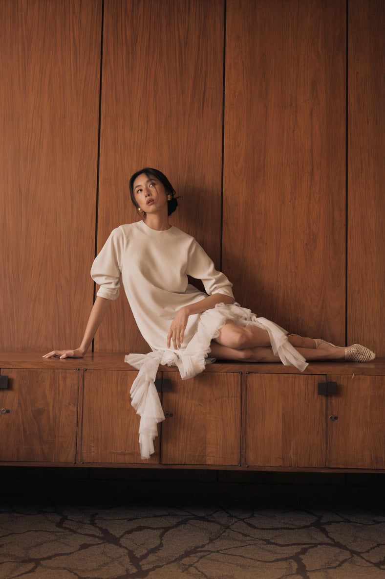 Vania Romoff The Ophelia Dress in ivory  features a relaxed silhouette in ivory stretch crepe, with softly gathered sleeves and cascading ruffles 