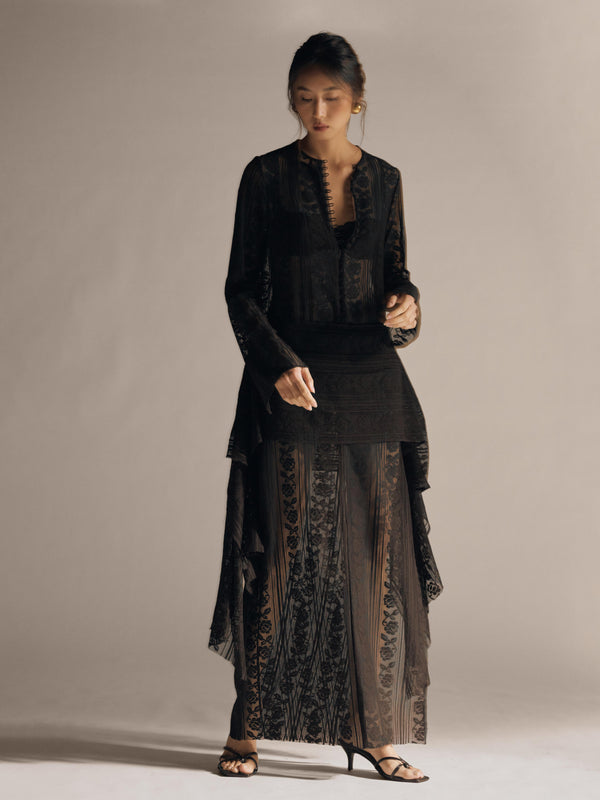 Vania Romoff The Ruth Dress in black  features delicate black floral lace, a plunging neckline, and long sleeves