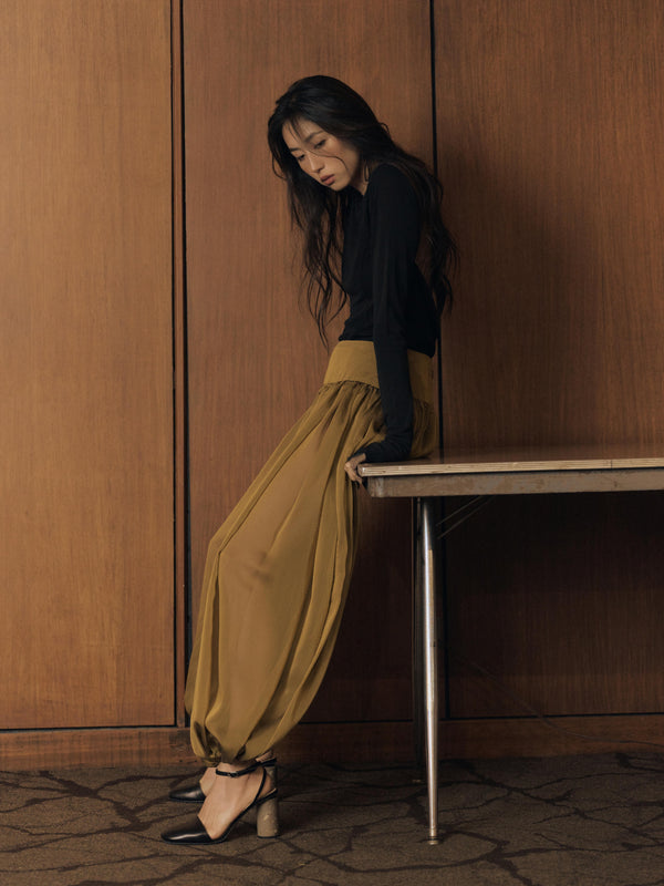 Vania Romoff The Sybil Pants in Amber Green feature a voluminous silhouette in lightweight khaki chiffon